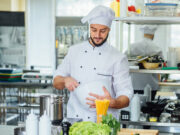 happy male chef cook restaurant kitchen